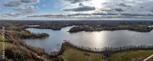 Fototapeta Naklejka Na Ścianę i Meble -  Lake Carmaņa,Latvian countryside, landscape, autumn forest in Latgale.