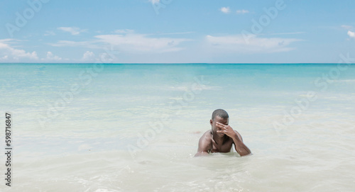 Young black man enjoying Caribbean Sea
