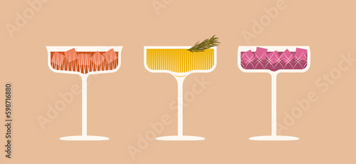 Vector illustration of a cocktails in crystal glasses with decoration. Festive glamour drinks in coupe glasses photo
