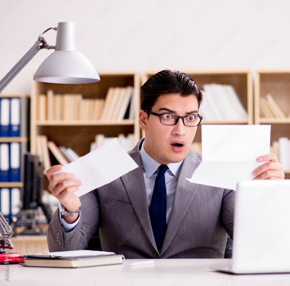 Businessman receiving letter envelope in office