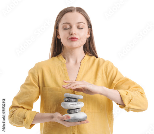 Canvas Print Young woman with spa stones on white background. Balance concept