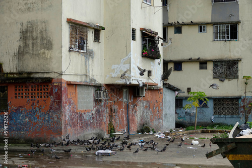 Neglected corner street full of pigeons in deprived district of Panama City