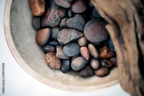 Driftwood and river stones. Still Life Photography.
