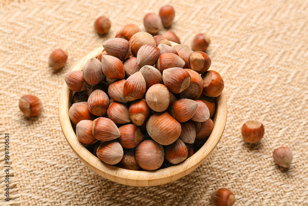 Bowl with shelled hazelnuts on table Bowl with shelled hazelnuts on table
