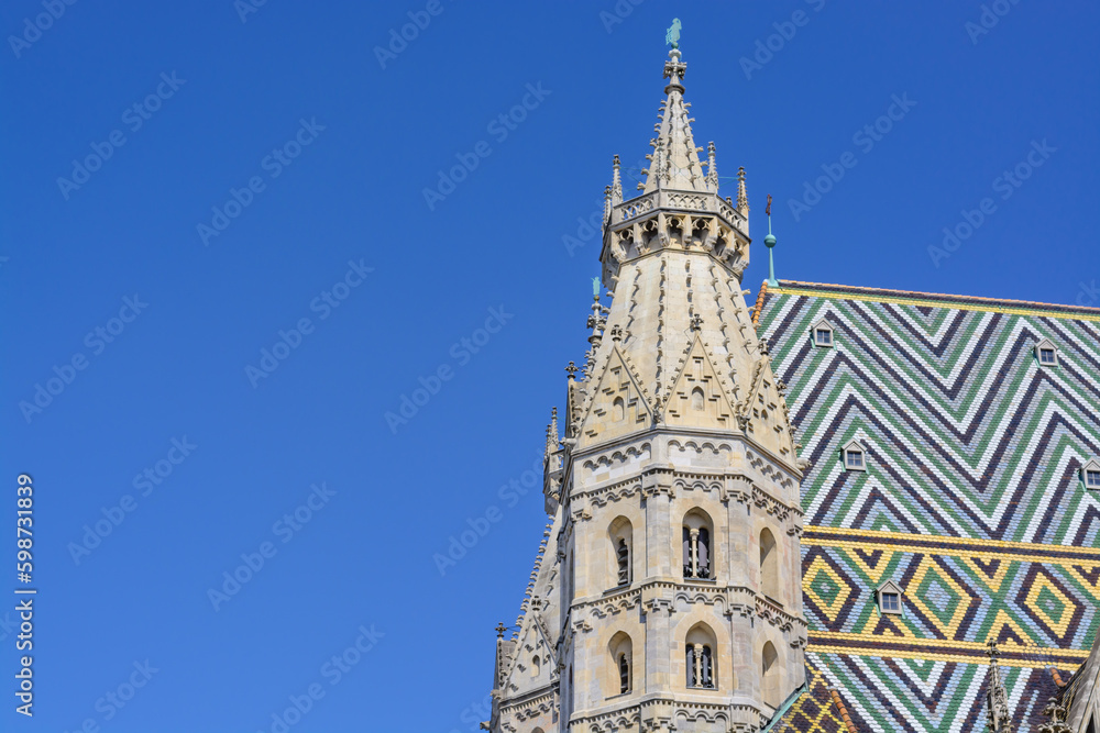 Tower of St. Stephen's Cathedral in Vienna against the blue sky