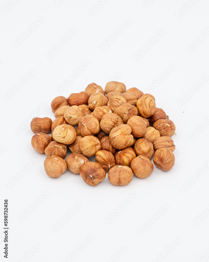 Peeled hazelnuts on a white background Peeled hazelnuts on a white background
