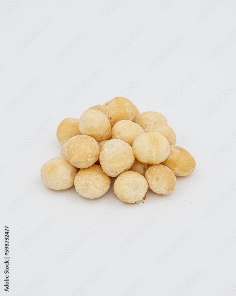 Macadamia hazelnuts peeled on a white background Macadamia hazelnuts peeled on a white background