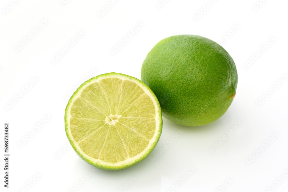 whole lime and sliced lime on white background with shadows 1 whole lime and sliced lime on white background with shadows 1