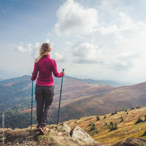 Young woman n the top of the mountains