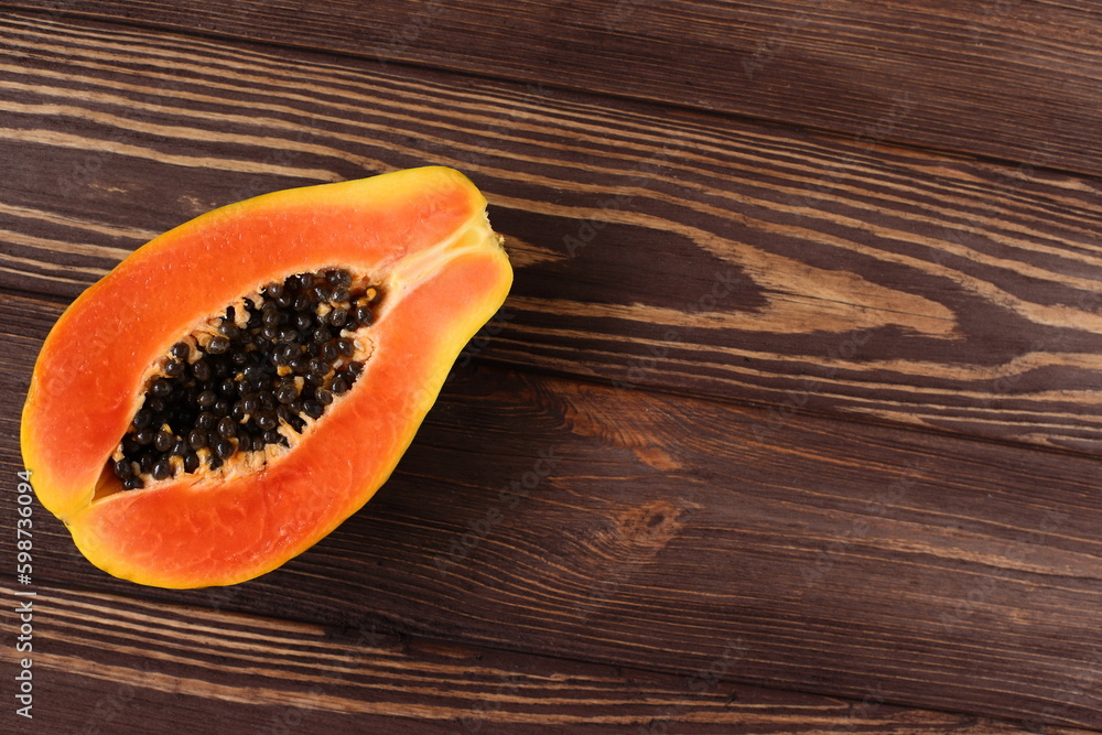 Papaya fruit on wooden table, fresh tropic pawpaw Papaya fruit on wooden table, fresh tropic pawpaw