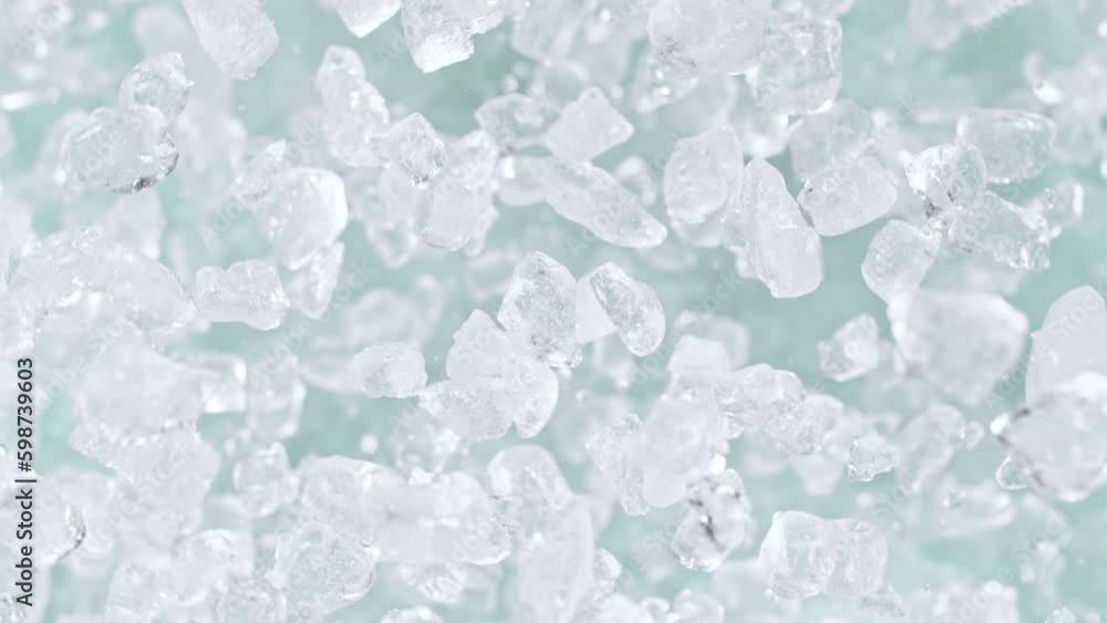 Super slow motion of rotating ice cubes, top view shot. Filmed on high speed cinema camera, 1000 fps, placed on high speed cine bot, following the target.