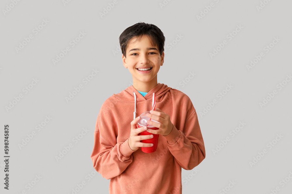 Little boy with soda on light background. Children's Day celebration Little boy with soda on light background. Children's Day celebration