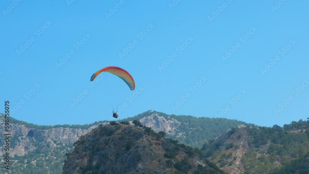 Feel wind during skydiving. A view of person with paraglider feel the freedom above tropical mountains in the sun light. Generative AI Feel wind during skydiving. A view of person with paraglider feel the freedom above tropical mountains in the sun light. Generative AI