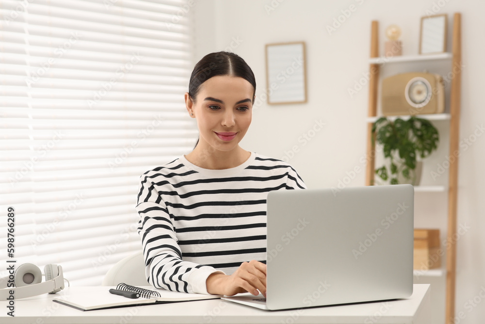 Online translation course. Student typing on laptop at home Online translation course. Student typing on laptop at home