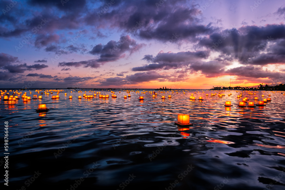 The Floating Lantern Memorial ceremony held off Magic Island, Oahu with personal message on reusable lanterns - obrazy, fototapety, plakaty 