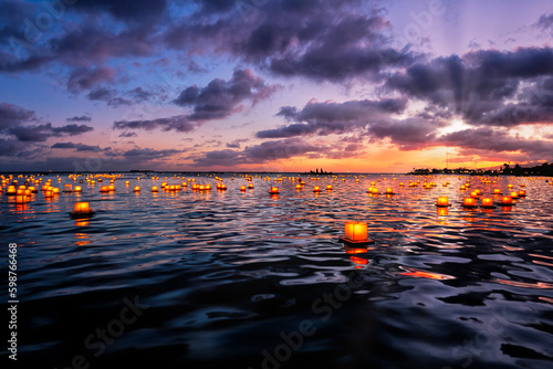 The Floating Lantern Memorial ceremony held off Magic Island, Oahu with personal message on reusable lanterns