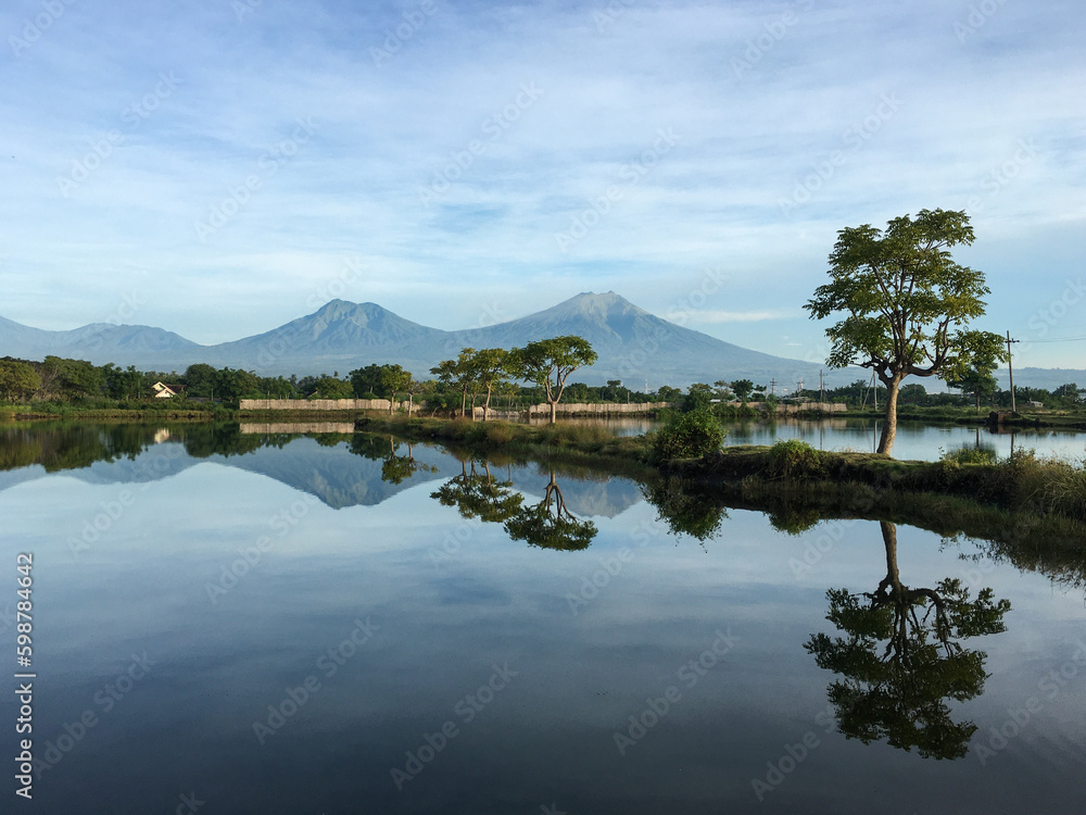 A very beautiful morning with views of mountains, blue and clear sky , lakes and trees.