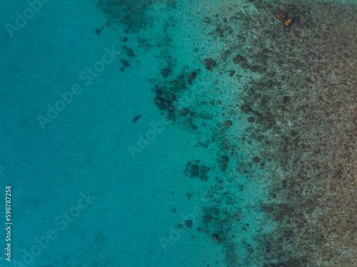Aerial drone view of beautiful beach with turquoise sea water of Gulf of Thailand. Kood island, Thailand.
