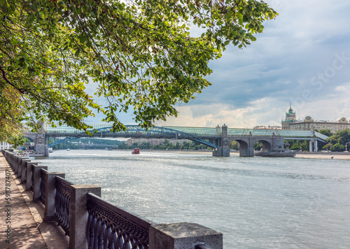 View of the Moscow river embakment, Pushkinsky bridge and cruise ships at sunset. photo