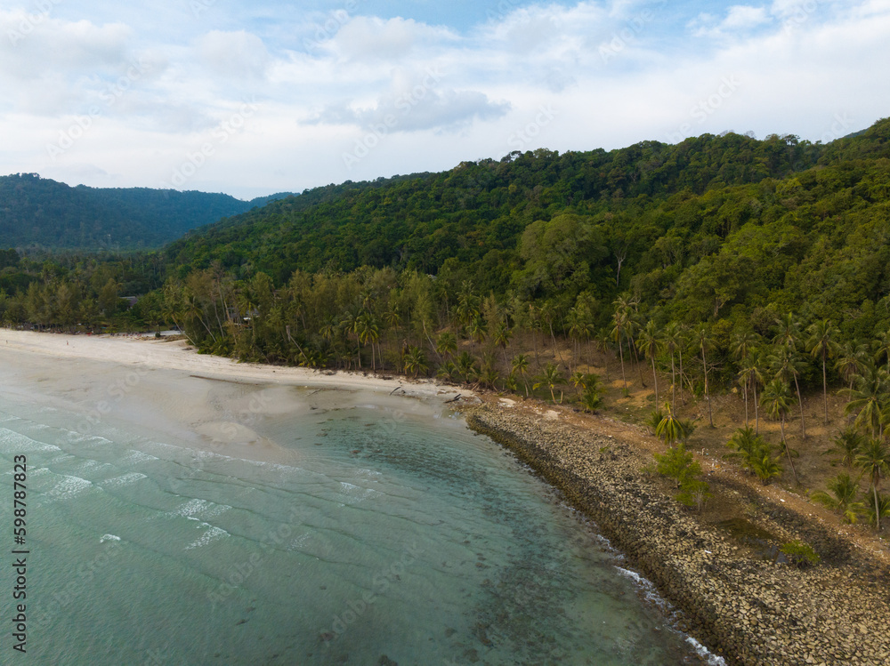 Aerial drone view of beautiful beach with turquoise sea water and palm trees of Gulf of Thailand. Kood island, Thailand. Aerial drone view of beautiful beach with turquoise sea water and palm trees of Gulf of Thailand. Kood island, Thailand.
