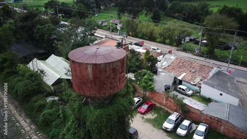 flying over huge rusty water tank