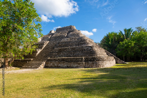 Mayan Ruins in Central American. Chacchobean Mayan ruin site in Mexico view of a large pyramid or temple in an open plaza