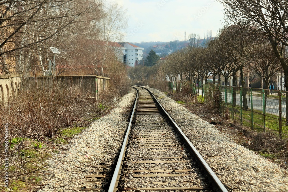 Single-track railway on the outskirts of the city