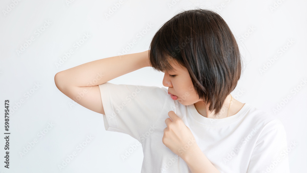 Woman sweating under armpit because of hot weather. Woman sweating under armpit because of hot weather.