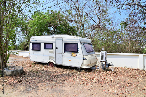 BANGKOK, THAILAND - MAY 10, 2023 : Modern Caravan Home constructed from aluminum abandoned in the middle of nature at Thailand.