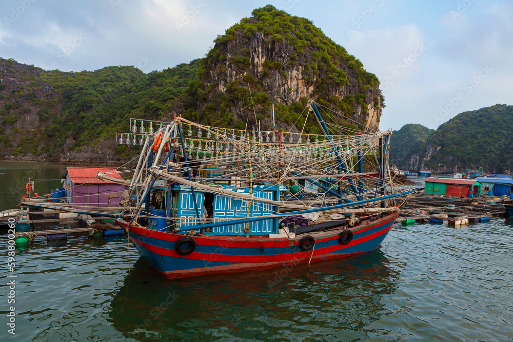 Vietnamese fishing schooner in halong bay, vietnam, southeast asia