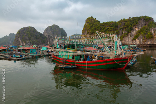 Vietnamese fishing schooner in halong bay, vietnam, southeast asia