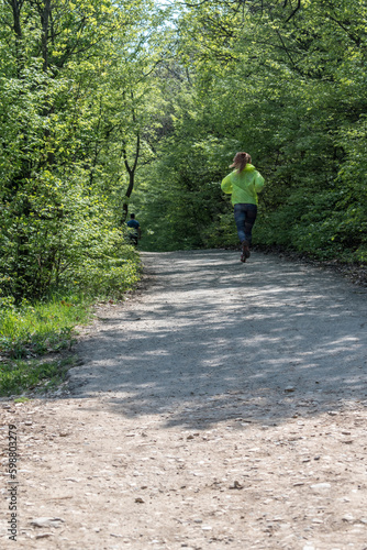 A person walks in the park in fresh air.