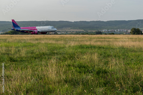Arriving plane at the airport in the middle of the tourist season.