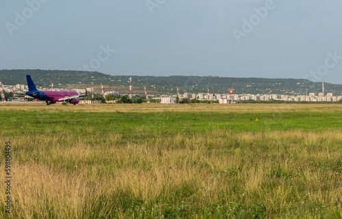 Arriving plane at the airport in the middle of the summer season.