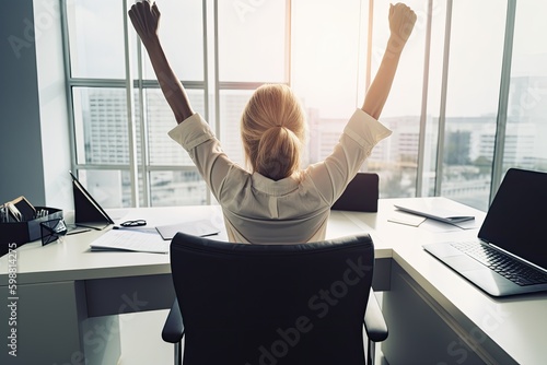 Rear view of a female executive in her office celebrating success with her arms raised. Generative AI