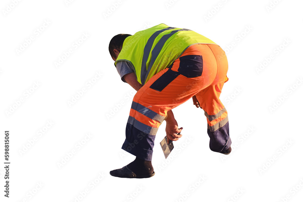 A road worker draws markings on the asphalt with white paint, isolated on a white background A road worker draws markings on the asphalt with white paint, isolated on a white background