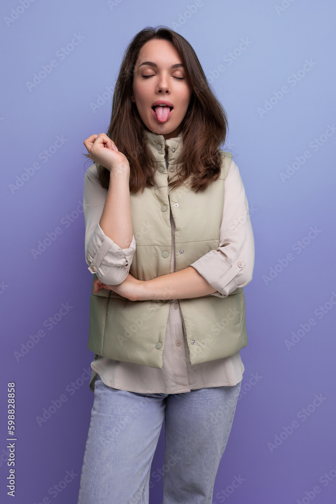 portrait of pretty brunette young woman with grimace portrait of pretty brunette young woman with grimace