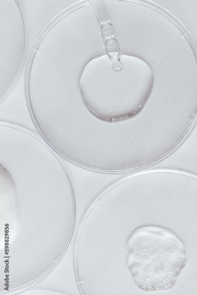 Pipette with Sample of Gels Cosmetic Product in Petri Dish on white background