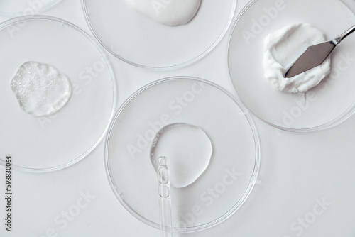 Obraz na płótnie Cosmetics Samples in Laboratory Glassware on white background, consistency test of gel and cream w salonie