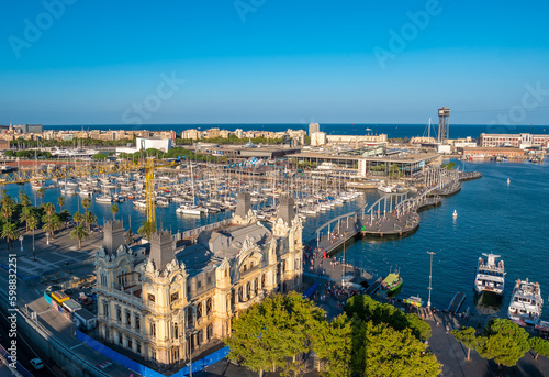 Panoramic aerial view of the port of Barcelona, Port Vell from the top of Columbus Monument at sunset