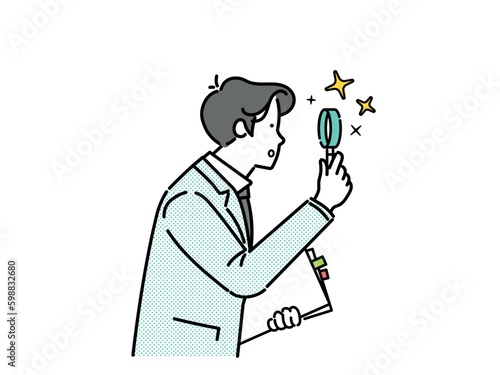male businessperson examining with a magnifying glass.