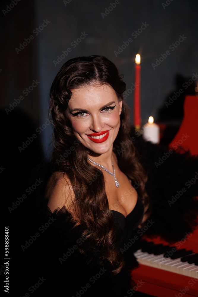 Beautiful woman in retro style fashion black underwear and stockings, red lipstick, hairstyle. Red piano and round spot light, aperture. Girl portrait, porsh look, gloves Beautiful woman in retro style fashion black underwear and stockings, red lipstick, hairstyle. Red piano and round spot light, aperture. Girl portrait, porsh look, gloves