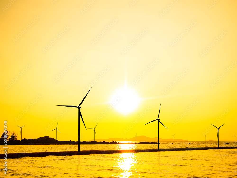 Turbine windmill Farm offshore Sea Sunset Background,Zero Carbon Energy Sustainable Wind Mill Industry Technology in Ocean,Power Plant Electric in Water Nature,Environment Future Generator Business.