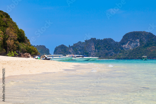 Fototapeta Naklejka Na Ścianę i Meble -  A small Bamboo island in the Andaman Sea with coral reefs, clear water and soft clean sand. Traveling with excursions in Thailand, Phuket. Snorkeling spots.