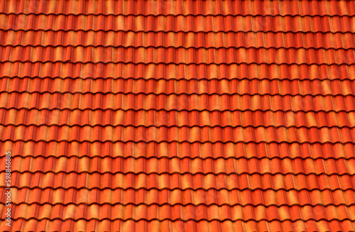 Orange Roof tiles have a seamless texture and roof pattern. The concept for the roof housetop icon with brown roofing tiles. banner texture for roofers.