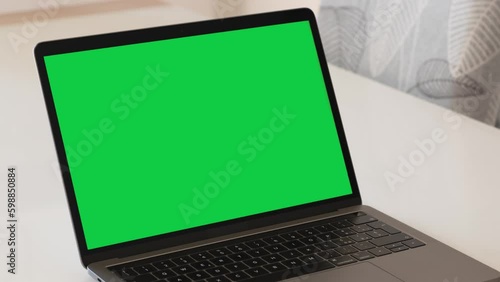 Wallpaper Mural Zooming on a Green Screen Laptop on a White Table at Home Torontodigital.ca