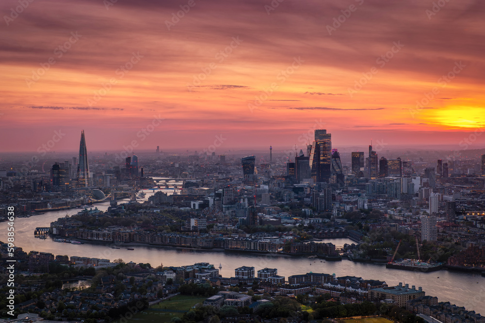 Beautiful sunset behind the modern cityscape of London, United Kingdom, elevated, panoramic view