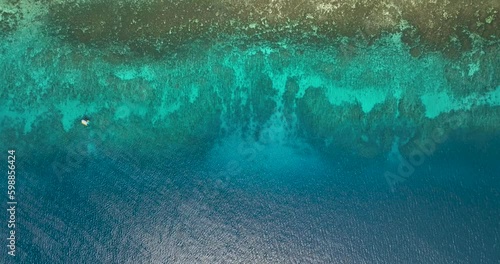 Sea water surface in lagoon with coral reef copy space for text. Aerial view transparent turquoise ocean water surface. Siquijor, Philippines. photo