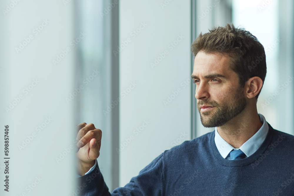 Im ready to make an impact. a handsome young businessman standing alone and looking contemplative. Im ready to make an impact. a handsome young businessman standing alone and looking contemplative.