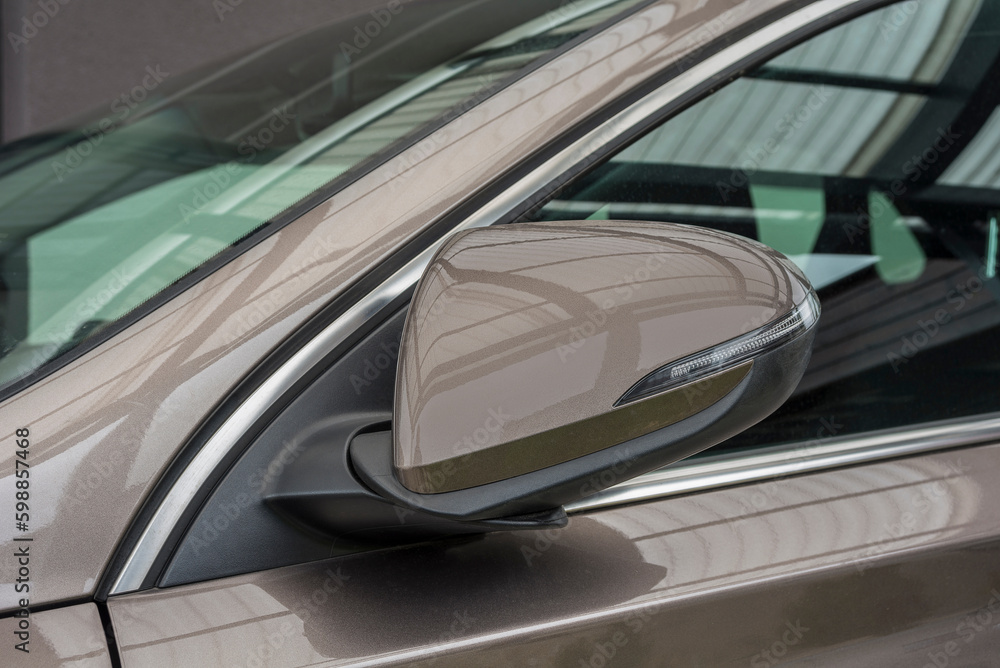 Fototapeta premium Folded side view car mirror placed on the exterior